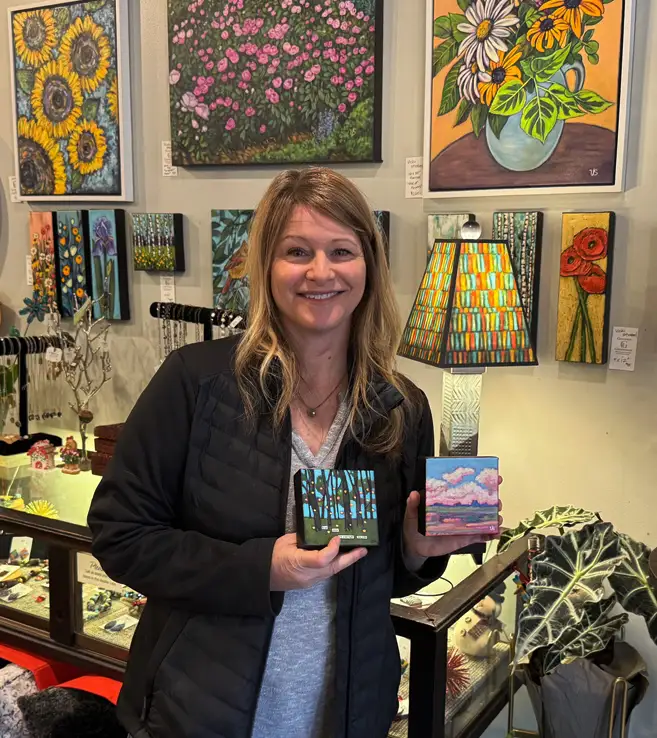 vicki holding paintings